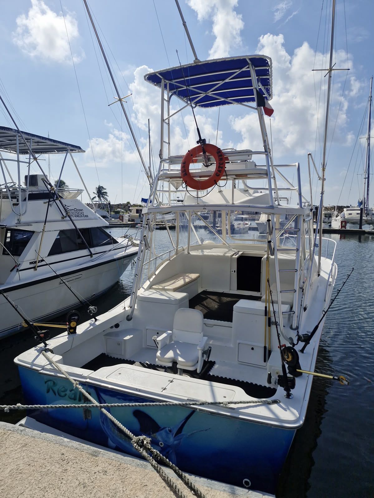 Post 33 sportfishing boat at Marina El CID for private fishing charters in Puerto Morelos